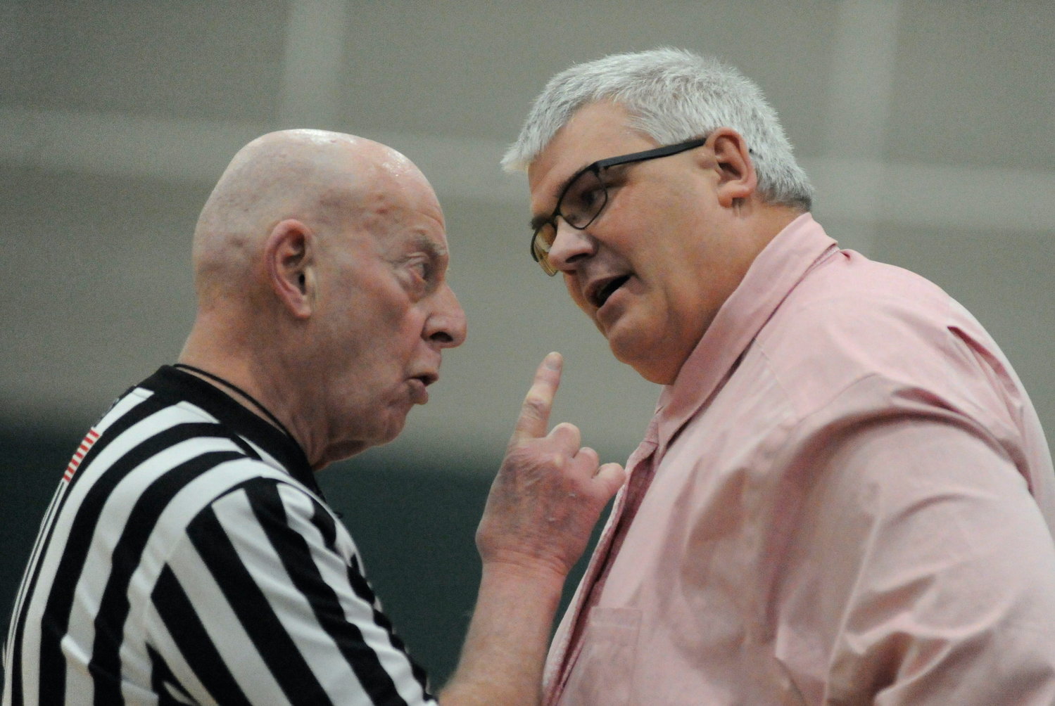 Now hear this. Veteran ref Mike Bernstein makes his point emphatically to Eldred’s coach Bill Furler on a disputed call from the court.
